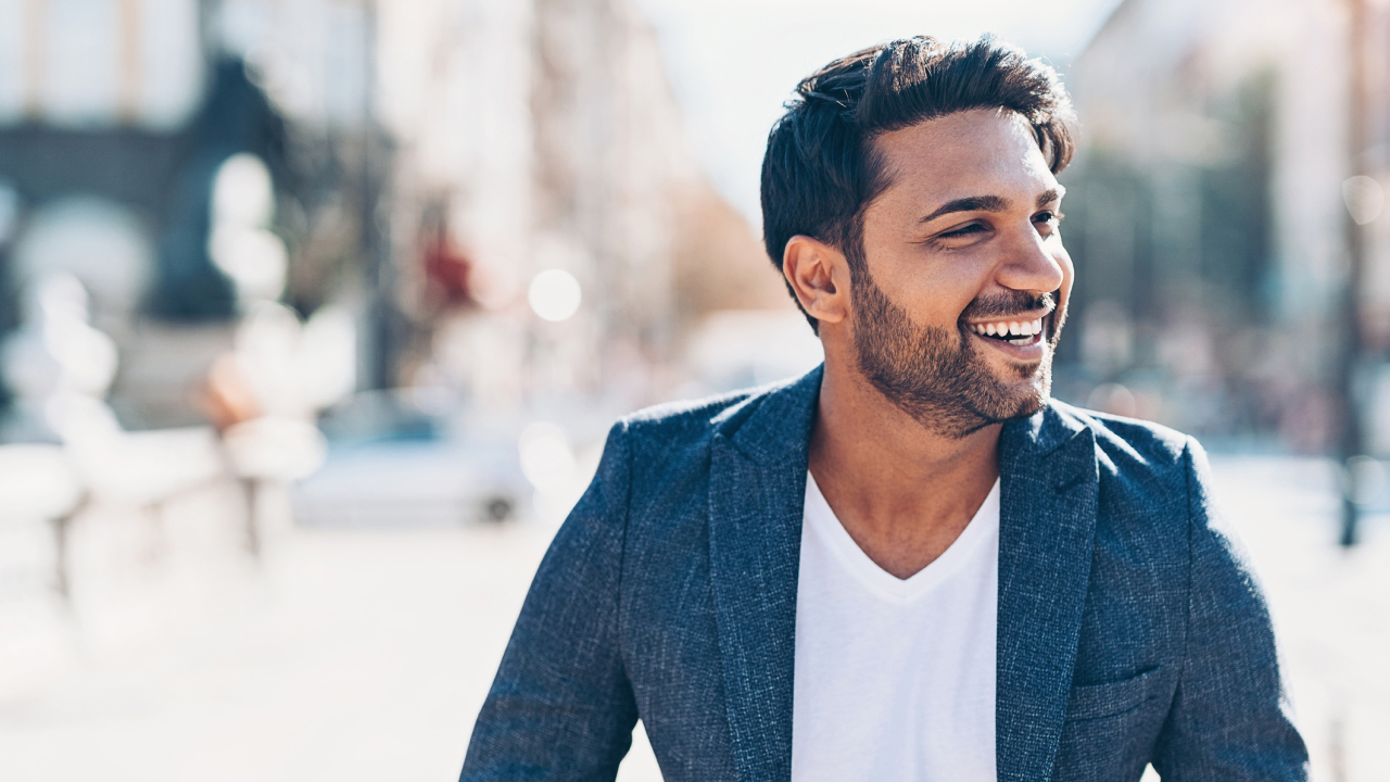 Smiling man on city street