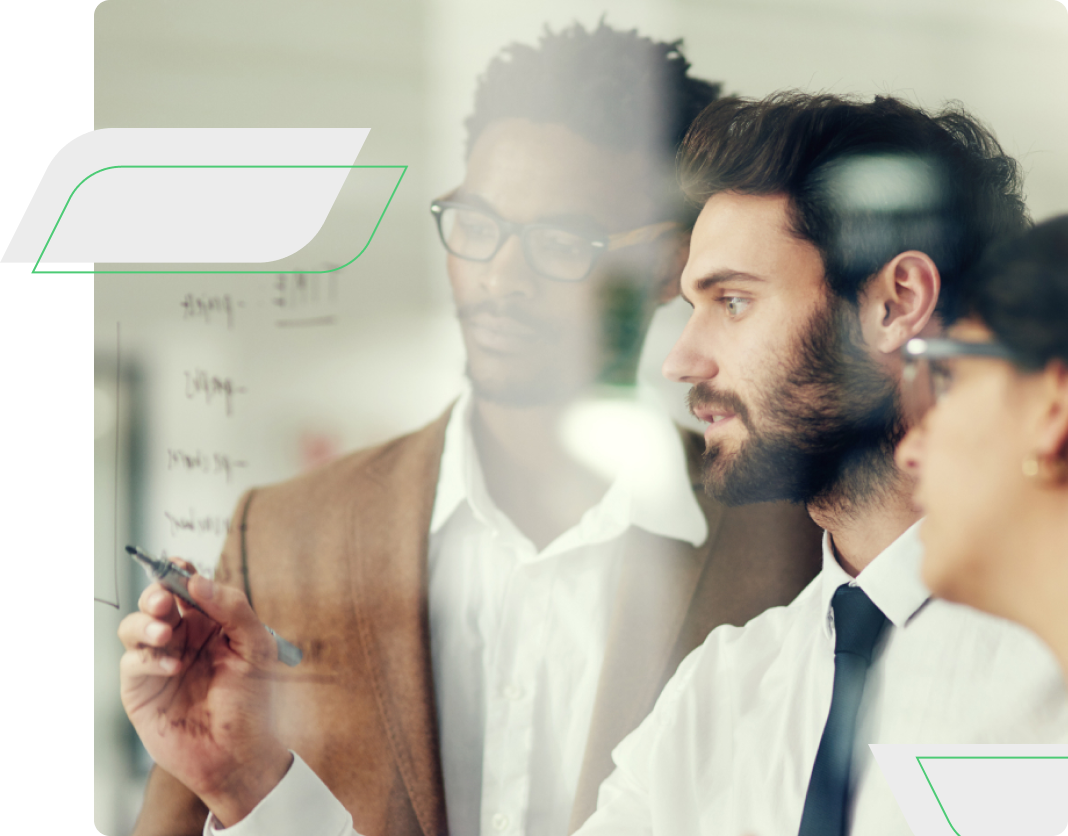 Business people planning while writing on glass together